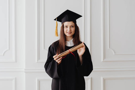 graduate holding a degree certificate
