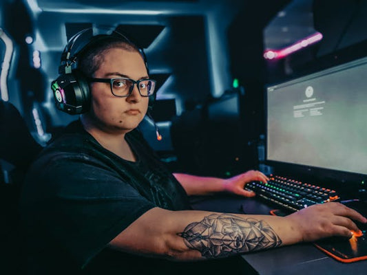 Focused e-sports player with headset in tournament setting