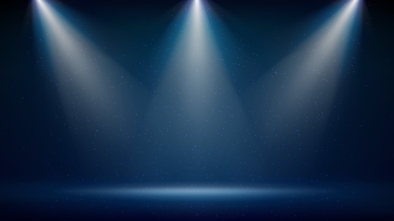 Empty stage under spotlight – symbolising performance pressure, stage fright, and mindset training