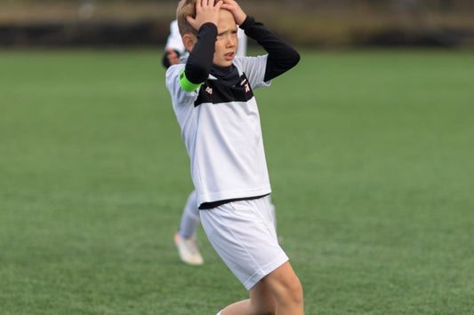 Young footballer nervous on the pitch
