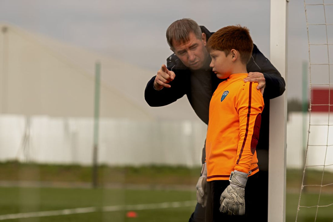youth goal keeper with coach