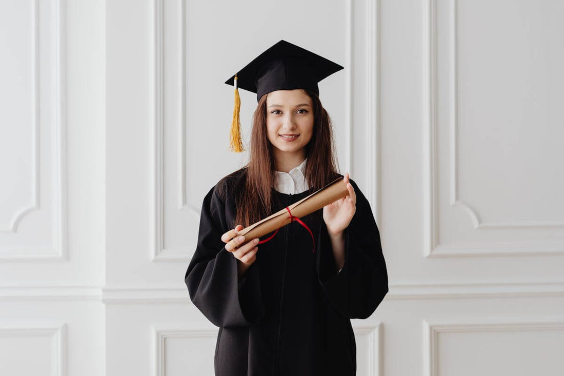 graduate holding a degree certificate