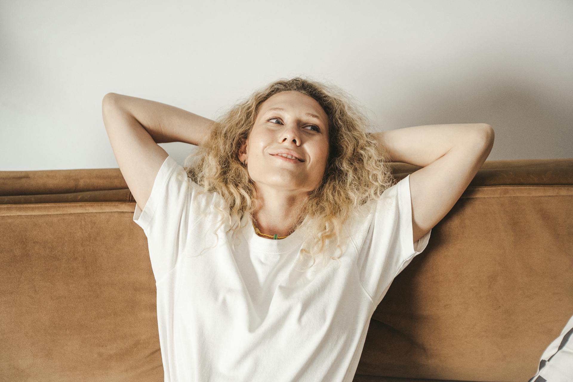 confident woman relaxing on a sofa